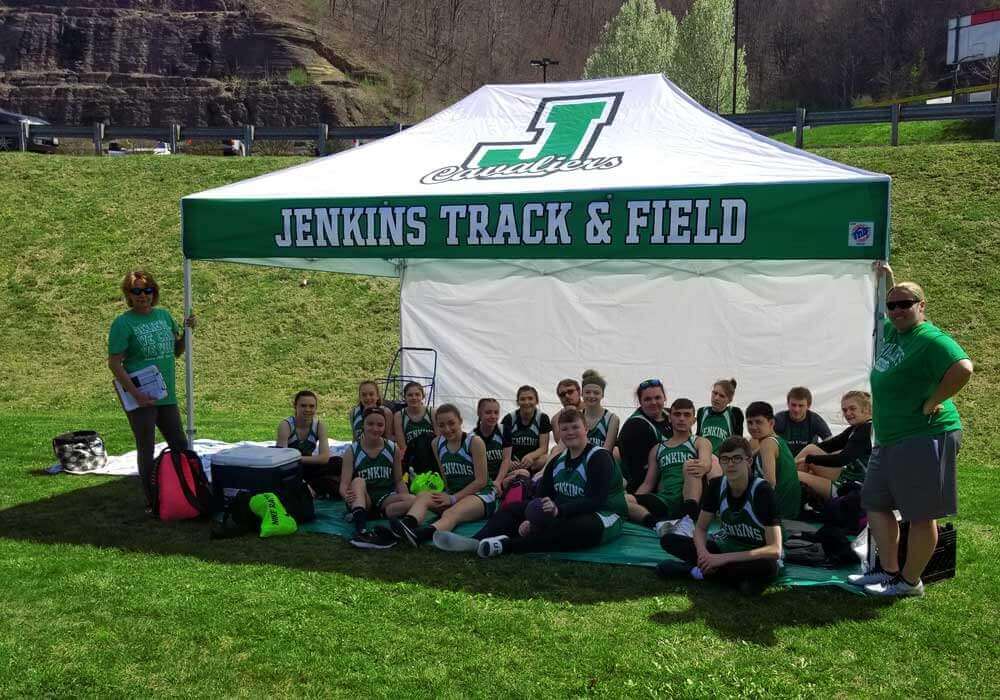 10x15 track and field tent with team underneath